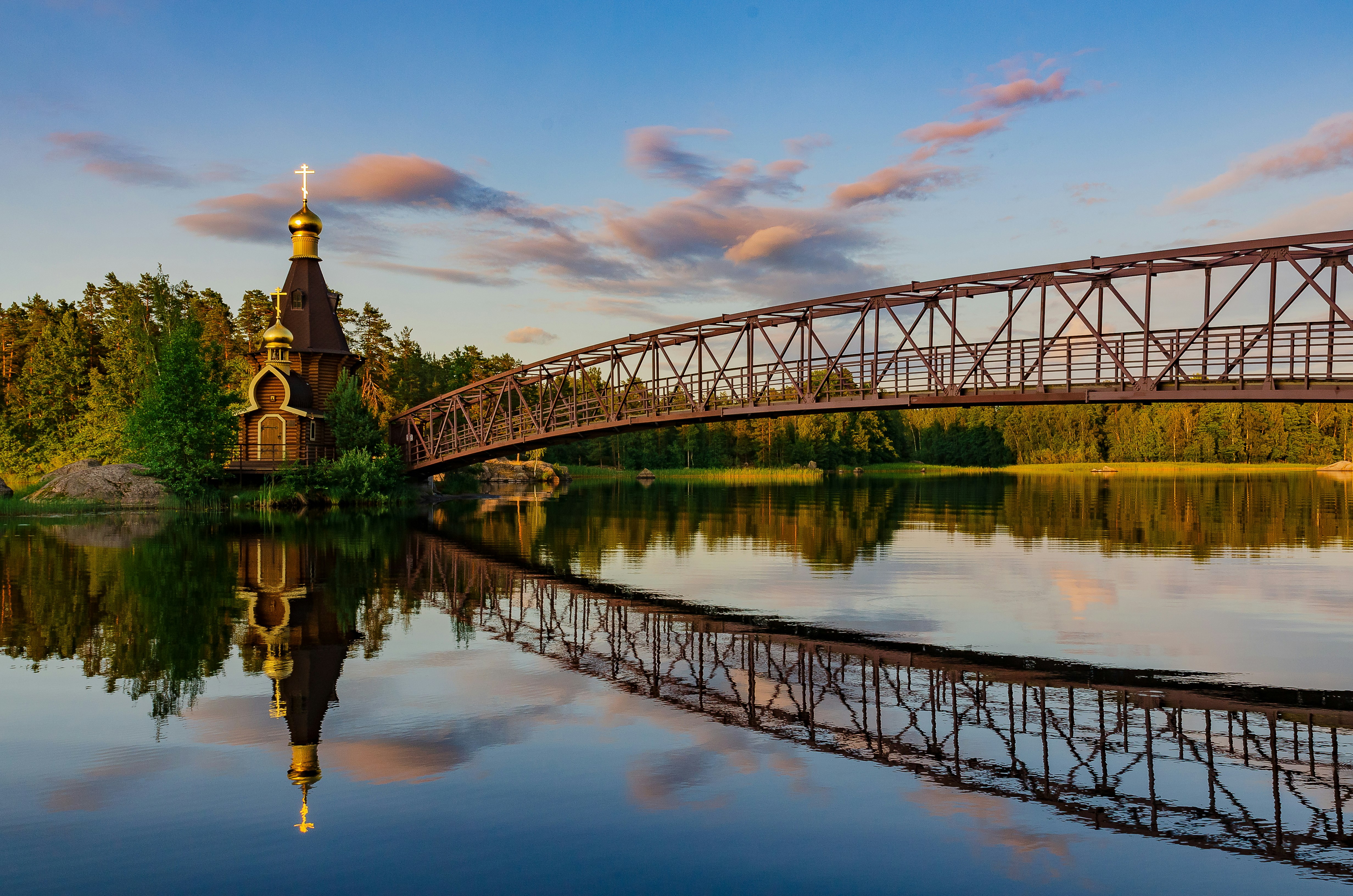 steel bridge above body of water